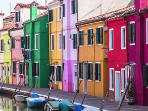 Multi Coloured houses next to a canal Burano Italy