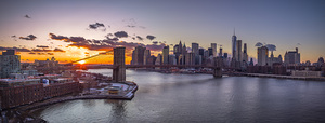 Evening view of Lower Manhattan skyline with Brooklyn bridge over East river New York