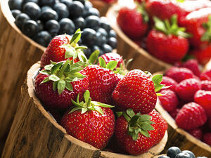 Berries in wooden pots