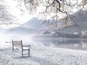 Bench and still lake, Buttermere, Lake District, UK