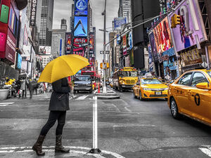 Man with umbrella at Times square