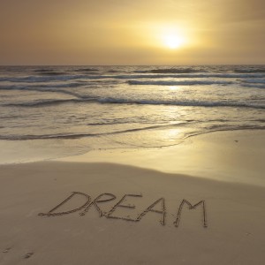 Sand writing - Word Dream written on beach