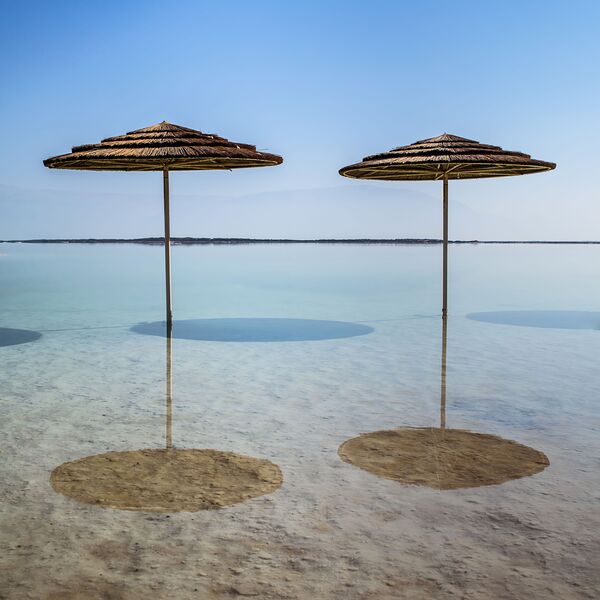 Beach parasol Dead Sea Israel by Assaf Frank