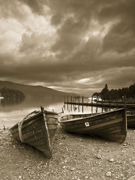 Boats on lake shore Print