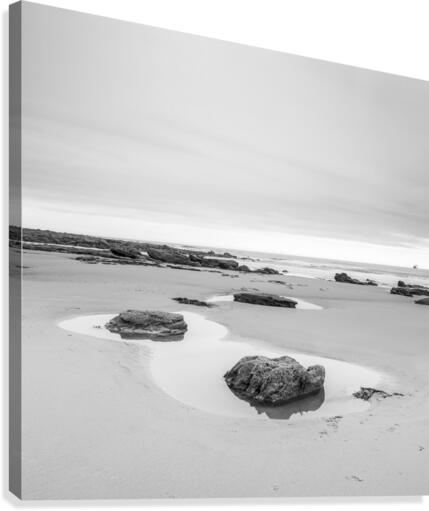 Rock pools on a sandy beach Canvas Print