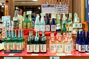 Sake bottles displayed at Nishiki Market in Kyoto Japan