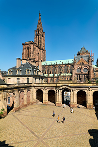 Visitors stroll in Palais Rohan courtyard view Strasbourg Cathe