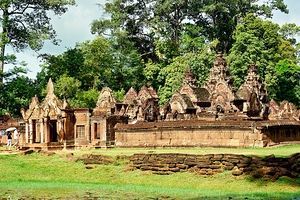 Ancient stone temple complex surrounded by lush jungle and water