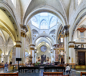 Visitors explore the interior of Valencia Cathedral in Spain