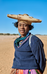 Woman of Herero Bantu ethnic group in Namibias landscape