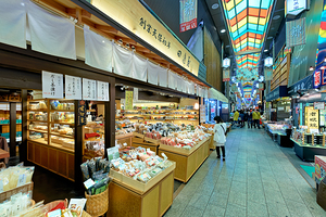 Exploring food stalls in Nishiki Market Kyoto Japan during the