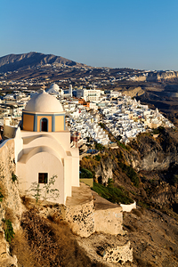 Iconic Santorini village and church overlooking caldera.