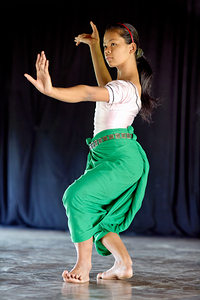 Young girl performing traditional dance.