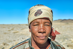 Portrait of a woman in Namibia with clear blue sky background