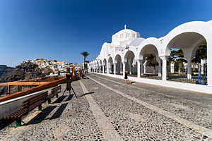 Santorinis iconic white church cobblestone path and cliffside