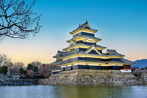 Matsumoto Castle stands proud against the sunset in Japan