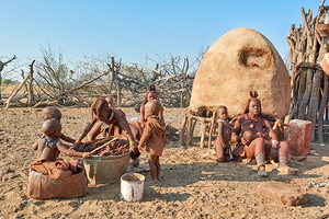 Family activities in Himba village in Kunene Region of Namibia