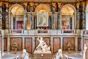 Opulent museum interior with classical statues paintings and m