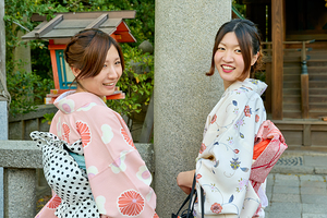Young women in kimono at Yasaka Shrine in Kyoto Japan