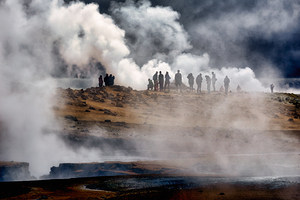 Visitors at Námaskarð hot springs in Iceland during a cloudy d