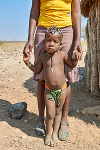 Portrait of Zemba Bantu child and mother in Kunene Region Namibi