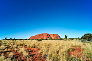 Uluru Australias iconic sandstone monolith under a clear blue