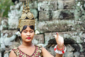Cambodian dancer in traditional costume and golden headdress.