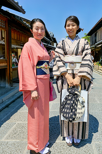 Women in traditional kimono walking in Kyotos Higashiyama distr