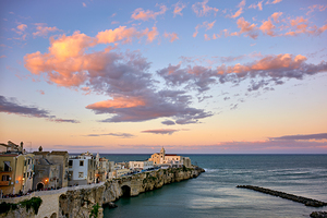 Vieste Gargano. Apulia Puglia Italy. Cape San Francesco and San Francesco church at sunset