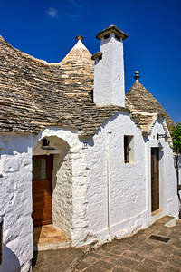 Apulia Puglia Italy. Alberobello. Trulli: traditional Apulian dry stone huts with a conical roof.