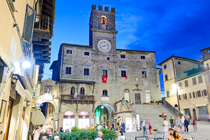 Cortona Arezzo Tuscany Italy. Palazzo del Popolo in Piazza della Repubblica at sunset