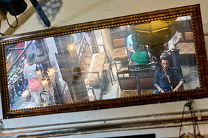 Istanbul Turkey. Men smoking through a hookah in a cafe