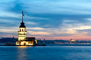 Istanbul Turkey. The Maidens tower on the Bosphorus and the Süleymaniye Mosque at sunset