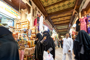 Oman. Muscat. Veiled women at Mutrah Souq