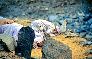 Pakistan. Muslim men praying towards Mecca