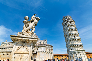 Pisa Tuscany Italy. Piazza dei Miracoli Square of Miracles. The Leaning Tower and fontana dei putti fountain of the angels