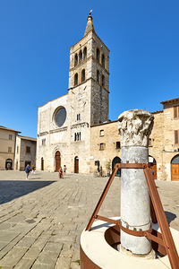 Bevagna Umbria Italy. San Michele Arcangelo church and roman column in San Silvestro square