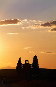San Quirico dOrcia Val dOrcia Tuscany Italy. Two women walking towards the Chapel Vitaleta Cappella della Madonna di Vitaleta