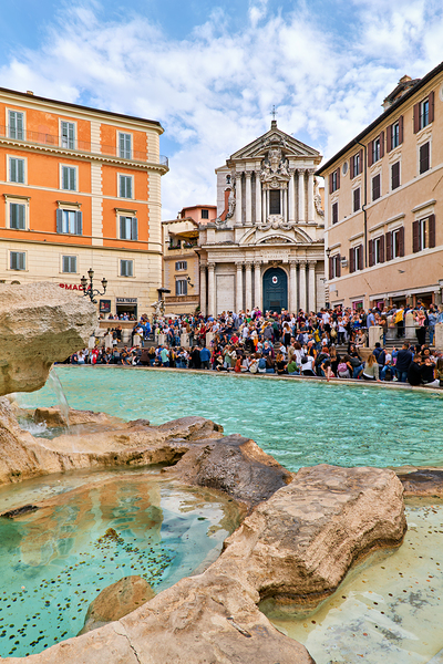Crowd enjoys the lively atmosphere at Trevi Fountain in Rome by Marco Brivio