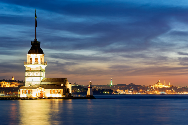 Istanbul Turkey. The Maidens tower on the Bosphorus and the Süleymaniye Mosque at sunset Print