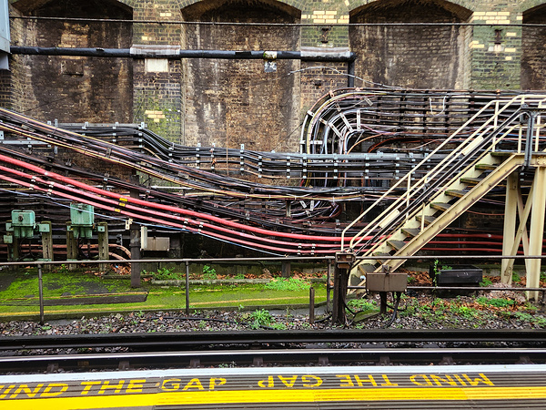 London Tube station with electrical conduits wiring and stairway Print