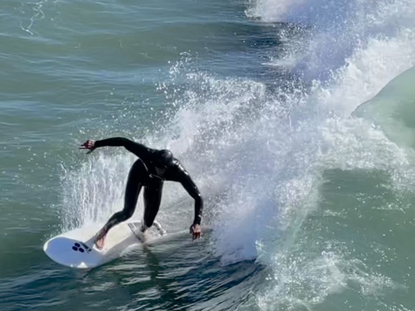 Surfing in Huntington Beach by Tom Bromann