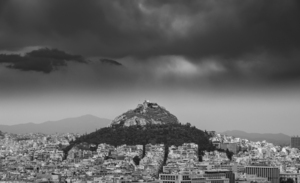 Lycabettus hill rises above Athens in a storm