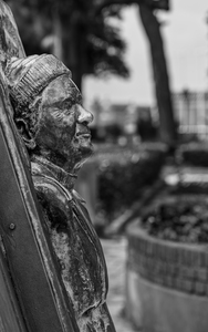 Statue of Lawrence Durrell in Corfu in black and white