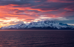 Sunset by Mt Fairweather and the Glacier Bay National Park in Al