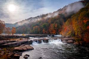 Sun rising over Valley Falls on a misty autumn day