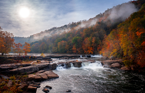 Sun rising over Valley Falls on a misty autumn day
