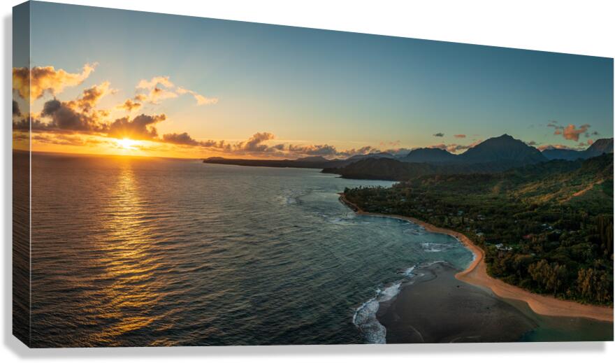 Widescreen panorama of sunrise over Tunnels Beach Kauai Hawaii