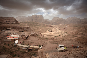 Souvenir stalls dot the rocky landscape of petra jordan under 