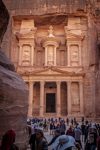 Tourists walking towards al khazneh the treasury in the ancien